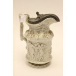 A Staffordshire moulded Stoneware jug with pewter cover,