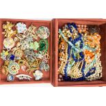 A jewellery box with vintage brooches,