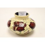 A Moorcroft vase in chocolate cosmos pattern, squat 1st quality vase, designed by Rachel Bishop,