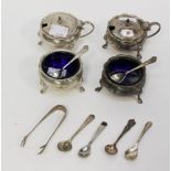 Two pairs of silver salts and mustard pots, blue glass liners,