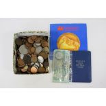 A box of assorted foreign and British coins, bank notes and wallets, etc.