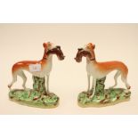 ****Ex Luddington Manor****A pair of 19th Century Staffordshire pottery figures, coursing dogs,