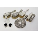 Two silver backed part dressing table sets, with a silver condiment set,