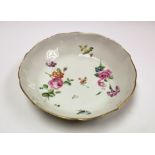A Derby Chelsea dish, circa 1769-75, ogee section and border, painted with floral bouquets,