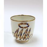 A Derby porcelain monogrammed coffee cup, circa 1782-1800, MM entwined with pearls,