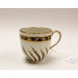 A Derby porcelain 20 pattern coffee cup, circa 1790, wrythen fluting and gilt blue fronds,