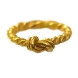 Large Viking Gold Ring of twisted band: ends twisted to form a knot. 8th to 12th Century AD.