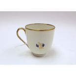 A Derby porcelain 129 pattern coffee cup, circa 1790, moulded fluting and floral sprigs,