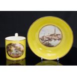 A Derby porcelain coffee can and saucer, yellow ground scene painted with Enisckerry and Bedford,