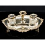 A Victorian silver ink stand, cast foliate and shell borders, on pierced bracket feet,