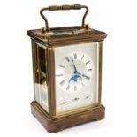 A gilt brass carriage clock, Swiss movement, signed MAtthew Norman to the dial,