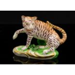 A Derby porcelain (attributed) miniature tiger figure, circa 1765, on Rococo scroll base, 6.