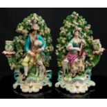 A pair of Derby patch mark figural candlesticks, circa 1760-65,