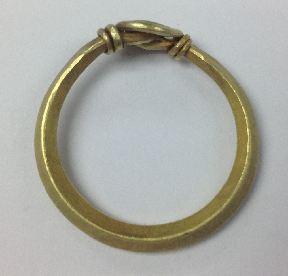 Anglo Scandinavian Gold ring with bond of lozenge wire ends twisted together forming a spiral.