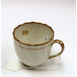 A Derby porcelain 17 pattern coffee cup, circa 1782-1800, relief moulded wrythen fluting, gilded,