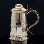 A George III silver lidded tankard, plain conical form with domed lid and pierced thumb piece,