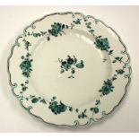 A Derby plate, circa 1770, green monochrome floral garlands and scroll moulded border,