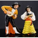 Royal Crown Derby Spanish Duet figure, modelled as a man playing a guitar,