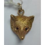 Gold Fox head pendant with detailing to the fur,