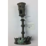 A bronze Medieval candle holder with socket to the top for candle;