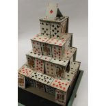 Vintage magic trick, collapsible "house of cards" on wooden stand.