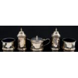 A George V silver double cruet, cylindrical form with wreath borders,