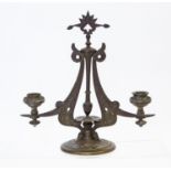 Christopher Dresser (attributed), a cast metal two branch candelabrum, circa 1870,