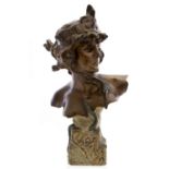 Pedro Rigual, An Art Nouveau bronze bust of Cleopatra, head turned, on a rusticated plinth,