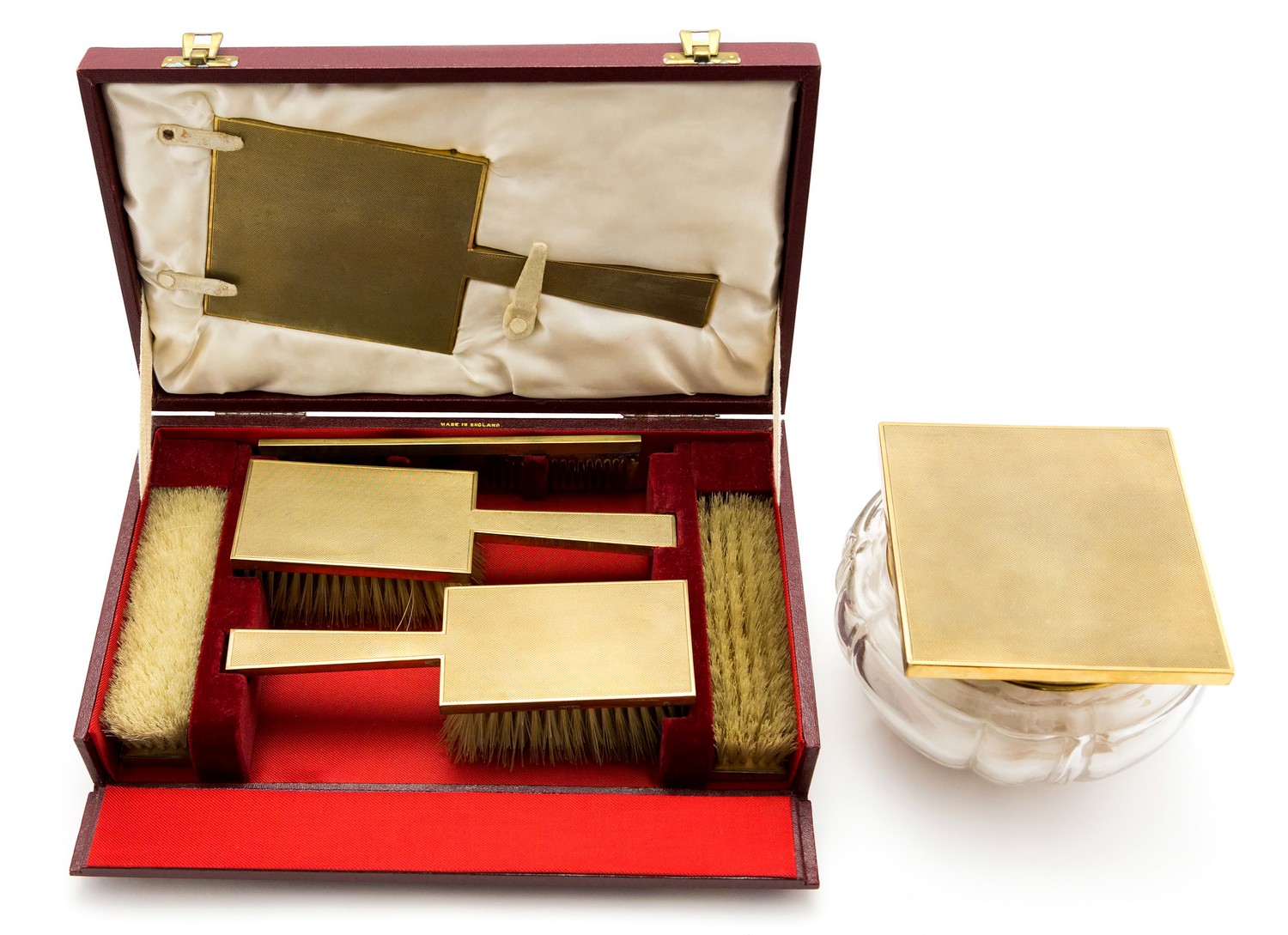 An Art Deco style 9ct gold mounted dressing table set, engine turned barley design, geometric form,