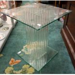 A Greenapple glass occasional table, tinted glass,