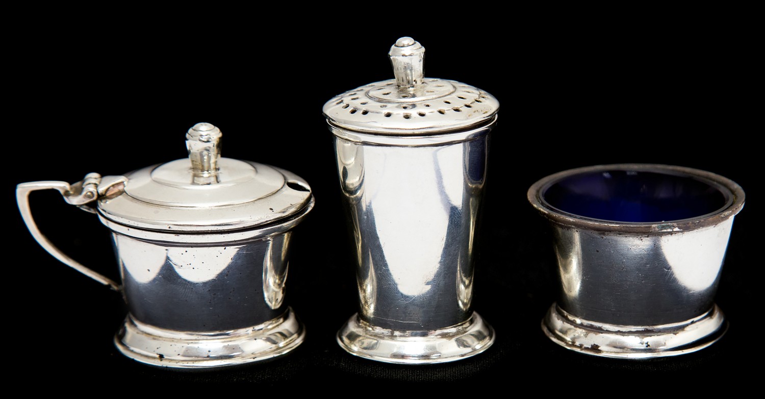 An Art Deco Indian Colonial silver cruet, conical form, including salt cellar,