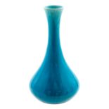 A Burmantofts faience art pottery vase, circa 1890, elongated trumpet bottle form, turquoise glazed,