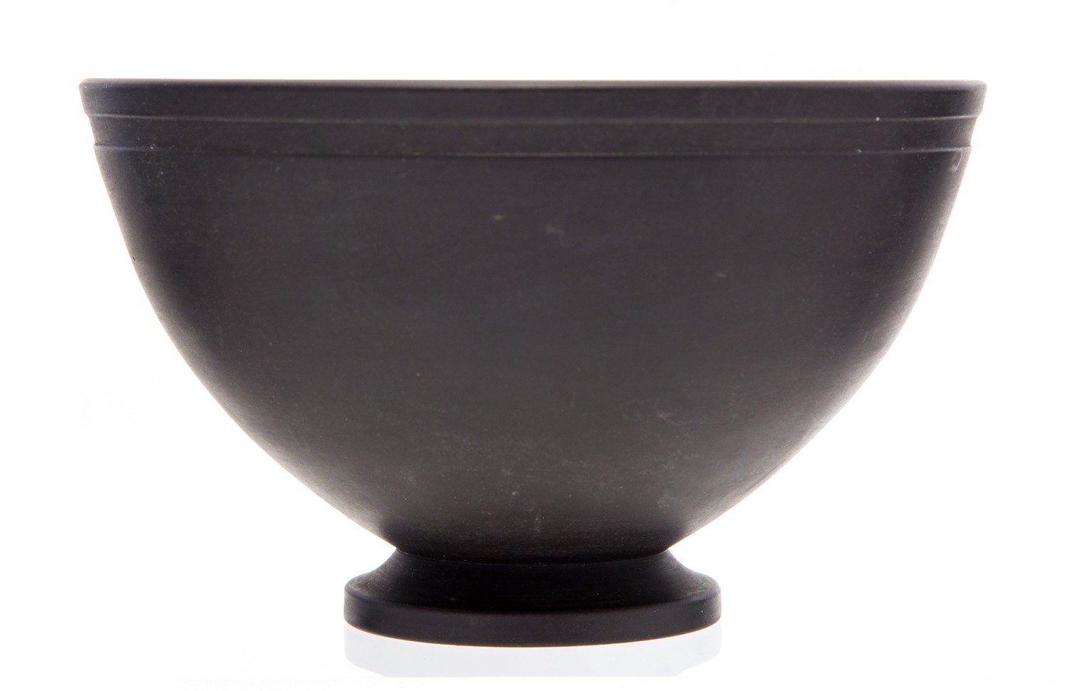 Keith Murray for Wedgwood,a black basalt bowl, number 3813, hemispherical form, on foot,