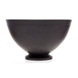 Keith Murray for Wedgwood,a black basalt bowl, number 3813, hemispherical form, on foot,