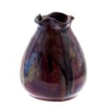 Bernard Moore, a miniature flambe lustre vase, ovoid form with crimped rim,