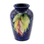 William Moorcroft, a Leaf and Berries vase, shouldered form, blue glaze,