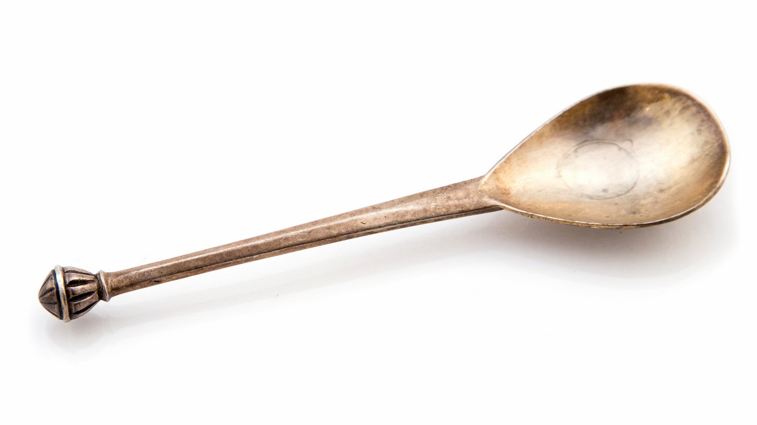 Guild of Handicraft, an Arts and Crafts silver spoon, planished form with reeded ball finial,