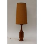 A 1967 teak, Danish style lamp base and shade,