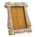 An Arts and Crafts silver photograph frame,in the Art Nouveau style,