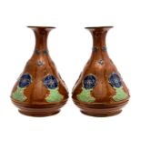 A pair of copper coloured Doulton Lambeth stoneware vases,