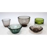 A collection of cut glass vessels including Simon Gate for Orrefors coloured glass bowl,