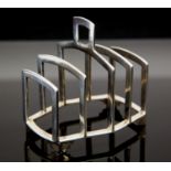 An Art Deco silver toast rack, four section, angled form on stepped bracket feet, Mappin and Webb,