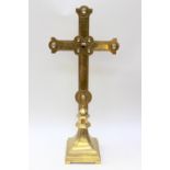 A Gothic Revival brass altar cross, the centre inset with a central Blue John cabochon,
