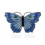 A silver and enamelled butterfly brooch, closionne and basse taille enamel in blue with green dots,