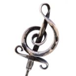 Charles Horner, an Arts and Crafts silver hat pin, the head in the form of a treble clef, mark CH,