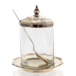 An Art Deco silver jam pot on stand, ribbed optic cylindrical glass jar with dilver cover,