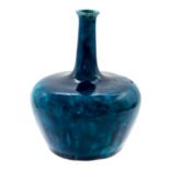 Bernard Moore, a monochrome high fired bottle vase, onion form, turquoise glazed on a Minton base,