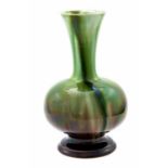 Christopher Dresser for Ault, an art pottery bottle vase, circa 1880, footed globe and shaft form,