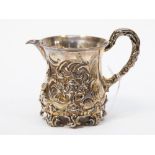 A Victorian silver/silver gilt Christening jug cylindrical, the body heavily chased with scrolls,