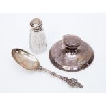 A Dutch white metal presentation spoon, a silver weighted capstan ink pot Birmingham 1915,